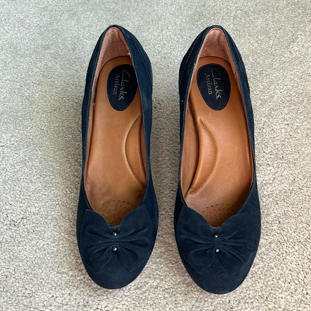 Clark’s Navy suede heels. In excellent condition. Just don’t wear heels anymore.